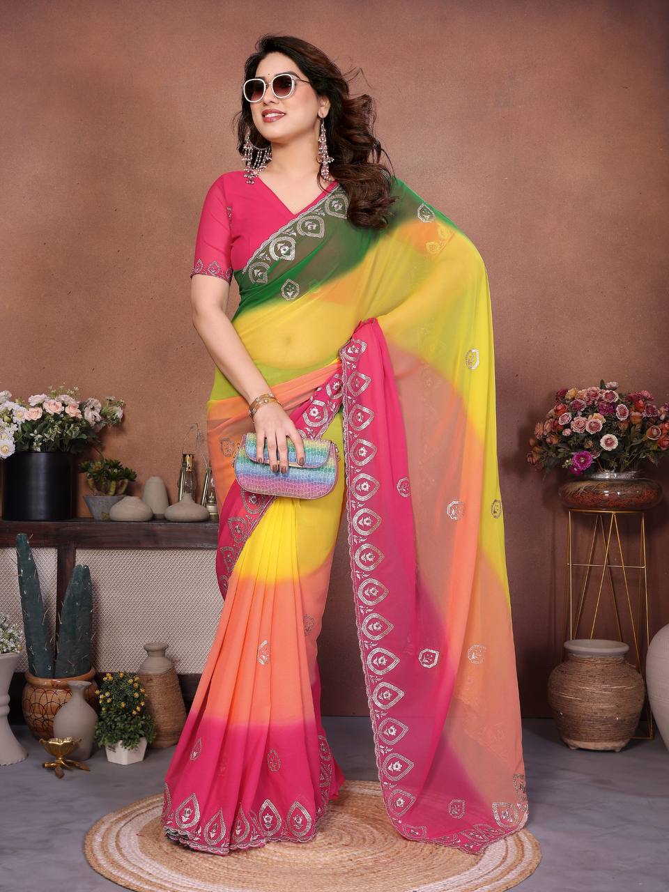 Rani Pink (Hot Pink): Featured on the blouse, pallu border, and the bottom skirt pleats.