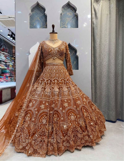 Rust Orange Heavily Embroidered Silk Lehenga Choli Set with Backless Tassel Detail and Intricate Silver Zari Work