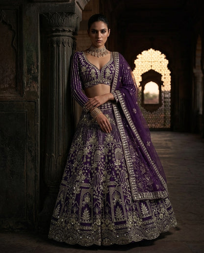 Royal Purple Heavily Embroidered Silk Lehenga Choli Set with Intricate Golden Zari Panels and Sheer Dupatta