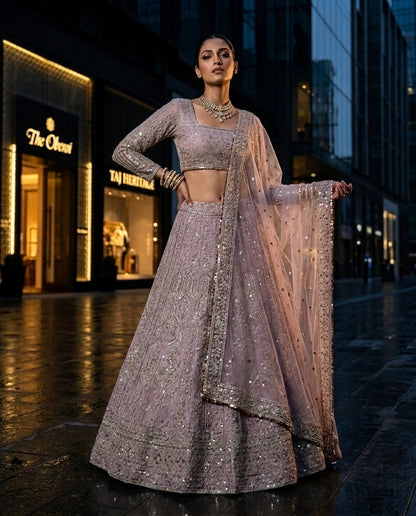 Muted Mauve Heavily Embellished Net Lehenga Choli Set with Full Sleeves and Intricate Sequin Zari Border